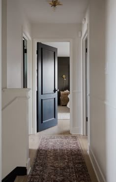 the hallway is clean and ready to be used as an entrance way for someone's home