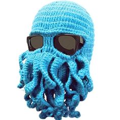 a knitted blue octopus hat with sunglasses on it's head and an eye patch