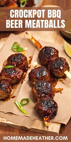 some meatballs are sitting on a piece of paper with green peppers and limes