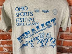 vintage late 80s/early 90s Ohio Sports Festival shirt. Single stitched screen stars tee. Excellent used condition no major issues to note MEASURES -  20" pit to pit and 26" long TAGGED - L but fits M My policy is NO RETURNS. If I made an error I will make it right 100% but I am not responsible if you change your mind/"item does not fit". PLEASE use the measurements provided if you don't know how ask me I will gladly help you :) - This is a TRUE VINTAGE item! Vintage clothing sizing varies wildly Sports Festival, Grunge Tee, Graphic Design Images, Festival Shirt, Late 80s, Festival Shirts, Gaming Shirt, Early 90s, Shirt Fits