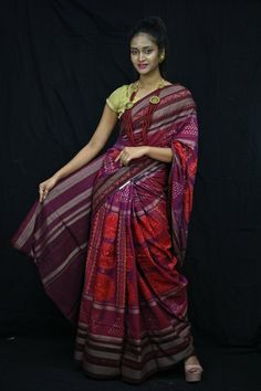 Finest pure handwoven sambalpuri ikat cotton saree with traditional motifs woven by the master weavers of Sambalpur, Odisha. It has lovely patterns and is world-famous for its gorgeous colours, texture and designs.  Specification                                                                                                                             Occasion       :- Casual Fabric               :- Sambalpuri Primary Color      :-  Purple Secondary Color  :-Maroon Material                :-Cotton Pattern               :- Motif Border Type   :-Ikkat Border Size       :-Medium Blouse Piece        :-Included Care               :- Dry Clean   Disclaimer : This is a genuine handwoven piece, It could expect unevenness in the selvedge and weave, and colours may fade or bleed due to the tradition Multicolor Ikat Print Pre-draped Saree For Navratri, Traditional Ikat Print Pre-draped Saree For Festivals, Navratri Ikat Print Pre-draped Saree, Bollywood Ikat Print Blouse Piece For Festivals, Traditional Drape Blouse Piece With Ikat Print For Festivals, Traditional Ikat Print Blouse For Festivals, Traditional Ikat Print Blouse For Diwali, Traditional Ikat Blouse Piece For Diwali, Multicolor Ikat Print Blouse Piece For Diwali