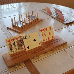 playing cards are arranged on a wooden table