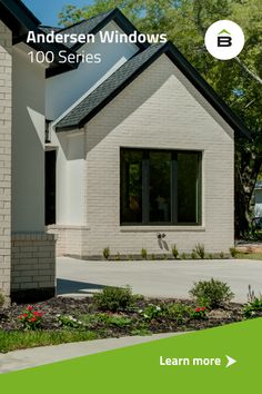 a house with windows and landscaping in the foreground, next to a green sign that reads anderson windows 100 series learn more