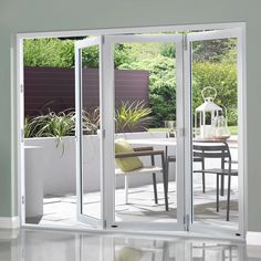 an open sliding glass door in the middle of a room