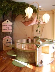 a baby crib in the middle of a room with lots of toys on it