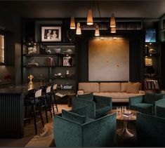 a living room filled with furniture and lots of shelves on the wall next to a bar