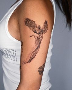 a woman with a tattoo on her arm