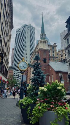 a clock tower in the middle of a city