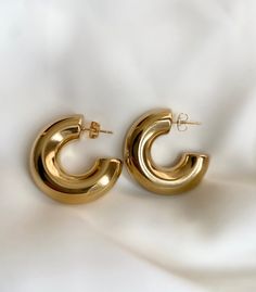 Elevate your day to night look with these chunky gold plated earrings. This classic, bold design it's a must have.  Makes a great gift for any fashion lover. Specification: Material: 18k PVD Gold Plated Stainless Steel Hypoallergenic Diameter: 30mm Thickness: 10mm What is PVD Gold Plated? PVD stands for Physical Vapor Deposition, and is a vacuum coating process of gold that produces a brilliant decorative and functional finish to the base metal. PVD utilizes a titanium nitride that provides an e Thick Earrings, Chunky Gold Earrings, Thick Gold Hoop Earrings, Thick Gold Hoops, Creole Earrings, Earrings Minimal, Chunky Hoop Earrings, Gold Hoops, Gold Plated Earrings