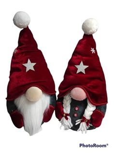 two red and white gnome hats with stars on them