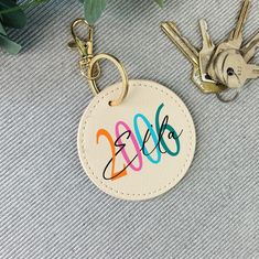 a keychain with the word sale written on it and two keys attached to it