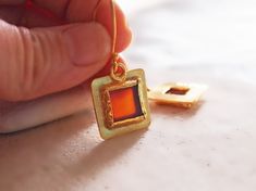 Minimalist, eye-catching handmade gemstone ring. Brown- orange rectangular carnelian set in a fine silver bezel and plated gold. This finger ring has an open asymmetrical shank with a very unique design. I love color combinations of gold - orange-brown colors. Rectangular carnelian ( agate ) stone set in a Gold Vermeil bezel ( gold plated on sterling silver)! Modern, eye-catching, handmade, this ring will be great jewelry for events, parties or special occasions. This lovely vermeil ring include Carnelian Earrings, Carnelian Agate, Orange Square, Carnelian Ring, Square Stone, Carnelian Stone, Stone Gold, Gold Orange, Finger Ring