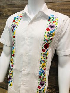 Mexican Guayabera.  Beautiful and Elegant.  Handcrafted in Merida, Yucatan Mexico. Made out of Cotton Polyester Blend Floral Multi Color Hummingbird Flower Embroidery  Two Embroidery Panels No Pockets  Short Sleeve.  Beautiful and Elegant Guayabera Wedding Shirt.  Traditional Mexican Shirt  Good for Casual wear, Wedding, Fiesta, Tropical, Birthday, Father Day, Special Event/Day etc.  100% Brand New  Please refer to size chart for proper fitment.  We gladly accept returns and exchanges with these terms and conditions.  We do charge a 25% Fee on any returns. This helps compensate for shipping fees, packing supplies and labor costs.  Exchanges have no cost.  Customer is responsible for shipping items back.  We do not provide prepaid labels.  Items should be returned just as received and with Guayabera Wedding, Mens Wedding Shirts, Traditional Mexican Shirts, Wedding Fiesta, Merida Yucatan Mexico, Mexican Shirt, Birthday Father, Merida Yucatan, Wedding Shirt