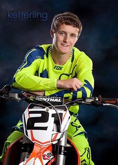 a man sitting on top of a dirt bike in front of a dark background with the words kettenering