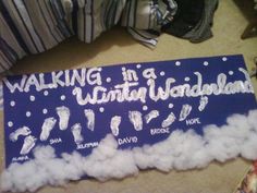 there is a sign that says walking in a winter wonderland on the floor next to clothes