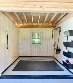 the inside of a storage room with black mats