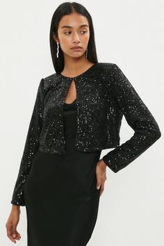 When in doubt, reach for sequins. Adding instant sparkle to formal looks, this gleaming bolero jacket features structured shoulders for a confidence-boosting fit along with long sleeves and a single hook closure. The boxy shape serves to keep the all-over embellishments in focus - perfect for anchoring a clean-lined midi dress or sumptuous satin separates.Style: JacketDesign: Fabric InterestFabric: SequinLength: RegularNeckline: Round NeckSleeve Length: Long Sleeve Bolero Jacket, In Focus, Formal Looks, Sequin Skirt, Embellishments, Sequin, Coats Jackets, Long Sleeve Blouse, Midi Dress