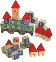 a group of wooden blocks with different shapes and sizes on top of each other, including a castle