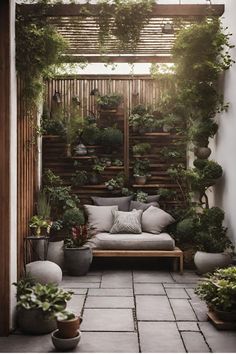 an outdoor seating area with potted plants