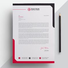 a red and white letterhead next to a pencil