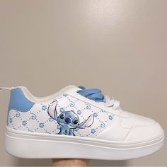 Brand New And Never Before Used Disney’s : Stitch Blue Hula Print Sneakers Size : 9 Us Mint Condition | Brand New | Tags Attached I Usually Ship Out My Packages Within 2-3 Business Days. If There Are Any Delays Due To My Schedule, I Always Make Sure To Let My Customers Know! All Sales Are Final | No Returns If You Have Anymore Questions, Please Feel Free To Message Me At Anytime! Casual White Sneakers With Cartoon Print, Casual White Sneakers With Character Print, White Low-top Sneakers With Cartoon Print, Trendy Low-top Sneakers With Cartoon Print, Casual Cartoon Print Sneakers For Streetwear, Casual Low-top Sneakers With Character Print, Disney Low-top Sneakers For Streetwear, Disney White Low-top Sneakers, White Disney Sneakers In Synthetic Material