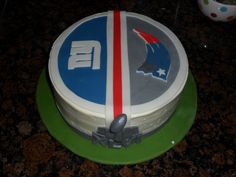 a cake decorated with the nfl logo on top of a green and white platter