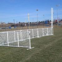 several soccer goal posts in the middle of a field