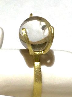 Rare 14k BRUTALIST MODERNIST POOLS OF LIGHT ROCK CRYSTAL GLASS ORB Ring!  in excellent condition! arrives in jewelry case and can be gifted immediately! crafted in solid 14k yellow gold and comes with 10 different gemstone spheres - each approx 10mm. there are natural gem orbs:  -moonstone with blue sheen (the moonstone is approx 7.55Ct please see photo for its carat weight), -South Sea Pearl wit diamond, -agate - eye like pattern( please see photos),  -lapis,  - golden sand stone,  -amethyst, Modern Yellow Gold Round Moonstone Ring, Contemporary Gold Round Rings, Contemporary Yellow Gold Rings As Gift, Modern Yellow Gold Moonstone Ring, Yellow Gold Polished Moonstone Ring, Modern 14k Gold Moonstone Ring, Modern Open Crystal Ring For Formal Occasions, Modern 14k Yellow Gold Moonstone Ring, Formal Rings With Si Clarity, Round Shape