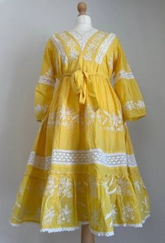 Beautiful and Stylish yellow cotton Summer Retro Embroidered Puff Sleeve, V-Neck A-Line Holiday Midi Dress, Ethnic Style Midi Dress, Bohemian Dress. The dress has a beautiful detailing of laces and white thread embroidery. It has long sleeves with lace details near elbow and white embroidery on the cuff.  Everything about this dress is dreamy. Details Color : Yellow Fabric : Pure Cotton Inner : Muslin Cotton  Embroidery: White thread work with crochet Lace work. Design: A-line Frock Style with V Bohemian Yellow V-neck Sundress, Yellow V-neck Floral Summer Dress, Yellow Bohemian V-neck Maxi Dress, Yellow Floral Print V-neck Maxi Dress, Yellow Patchwork V-neck Dress, Frock Style, Yellow Midi Dress, Cotton Midi Dress, Yellow Fabric