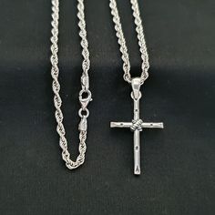 Silver Cross Necklace for men The necklace is made of 925 sterling silver and then plated with genuine rhodium plating. This means the necklace will stay shiny for a long time. The necklace has been oxidized. Thus, it has gained a more authentic and stylish look. Chain type : Rope Chain thickness : 2 mm Pendant width:  19 mm Pendant height: 30 mm  *It is a stylish gift option for yourself and your loved ones. You can choose it as a birthday gift, valentine's day gift, father's day gift and Christmas gift. It is a special gift option that you can give to your lover. gift for him..It is a chain suitable for sports and classic clothing styles. * Fast shipping! we use express shipping * Elegant packaging for gift * You can see examples of how the packages will look in our photos. (standard and Silver Cross Necklace With Sterling Clasp, Silver Cross Pendant Necklace With Sterling Silver Clasp, Silver Cross Necklace With Sterling Silver Clasp, Classic Silver Crucifix Necklace, Classic Sterling Silver Engraved Cross Necklace, Classic Engraved Sterling Silver Cross Necklace, Classic Sterling Silver Cross Charm, Classic Sterling Silver Crucifix Necklace, White Gold Crucifix Necklace With Silver Chain