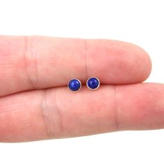 A great pair of Lapis Lazuli Stud earrings. These earrings are made of sterling silver and the stone measures 4 mm. Mix and match with my other stud earrings Includes sterling silver earring backs. Great for sensitive ears! This listing is for one pair of earrings Earrings are shipped in a gift box. *Please note as with all natural gemstones the color may vary from the pair shown. Dainty Blue Round Earrings, Blue Minimalist Hypoallergenic Earrings, Tiny Blue Minimalist Earrings, Minimalist Hypoallergenic Blue Earrings, Dainty Blue Earrings For Gifts, Minimalist Blue Everyday Earrings, Dainty Hypoallergenic Blue Earrings, Dainty Blue Hypoallergenic Earrings, Blue Minimalist Pierced Jewelry