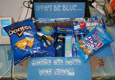 a blue box filled with snacks and candy