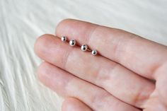 "Tiny and cute sterling silver ball stud earrings handcrafted from recycled solid sterling silver. These are unisex, simple everyday studs that will look great on their own or as additional studs in secondary ear piercings. ● you get TWO PAIRS: 4mm and 3mm ball studs Earrings will be shipped with standard sterling silver \"butterfly\" backs Also see: ► 3mm ball https://www.etsy.com/listing/178760615/3mm ► 4mm ball https://www.etsy.com/listing/178758585/4mm ► More MINI stud earrings: http://www.e Minimalist Silver Internally Threaded Piercings, Silver Sterling Silver Piercings As A Gift, Everyday Internally Threaded Sterling Silver Piercings, Adjustable Sterling Silver Piercings For Everyday, Nickel Free Sterling Silver Piercings As Gift, Nickel-free Sterling Silver Piercings As Gift, Hypoallergenic Sterling Silver Piercings, Tiny Silver Piercings For Gift, Tiny Silver Piercings As A Gift