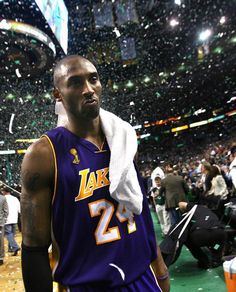 a basketball player is standing in front of confetti