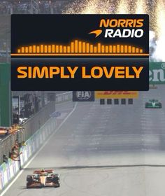 a race car driving down a track with fireworks in the air behind it and an advertisement for simply lovely