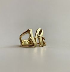 Solid Gold LOVE Ring made to order. Ring is made to fit your finger, cast and polished in 14K Gold. Exactly as pictured, it's a hefty piece of gold 😊 If you're not sure what finger size I can mail you a ring sizer. can be made in any metal upon request. Unique Personalized Gold Rings, Personalized Gold Rings With Unique Style, Unique Gold Engraved Promise Ring, Unique Gold Engraved Ring For Anniversary, Gold Rings With Initials For Valentine's Day, Valentine's Day Gold Rings With Initials, Gold Love Ring, Ring Sizer, Love Ring