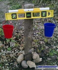 two buckets are attached to a tree with three different balance scale