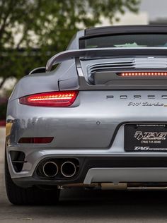 the back end of a silver sports car