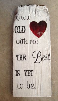 a wooden sign that says grow old with me the best is yet to be loved