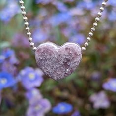 This Lepidolite was hand carved me into a heart shaped pendant. I got from Stone Haven Gems and it was mined in Madagascar! This pastel purple has literal flakes of sparkles throughout! Really cool! Wear alone, or pair with another with and a shape in the middle - make your necklace as unique as your are! The last image is a sample of this style paired with others for a visual reference. If you are looking to build your own necklace with 'wings', I recommend pairing with something that is close in dimension! If you have trouble envisioning a necklace, don't hesitate emailing me at gotstonedjewelry@gmail.com with the listing links and I will send you a picture of what it looks like :) If you decide on a chain, it will be 925 silver 1.5mm ball chain, shown in the images. If not, it will come