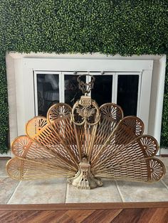 a decorative fan sitting in front of a window