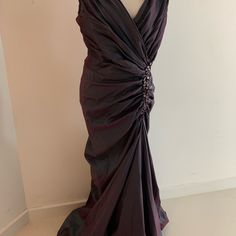 a dress on a mannequin in front of a white wall