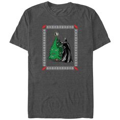 a t - shirt with an image of batman and christmas tree on the front, in grey