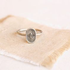 A kiss from the sun.  Full of life and warmth. This sweet stamped silver ring is perfect alone or stacked with other rings. Sterling silver.  Please select your ring size during checkout.Your jewelry will arrive beautifully gift wrapped in a small box. Multiple items will be combined, unless separate boxes are requested. If this is a gift being shipped directly to the recipient, please let me know. I will be glad to include a note from you.Want to see more of my work? Click here to return to my Silver Dainty Stamped Ring, Dainty Stamped Silver Rings, Spiritual Nickel-free Rings For Everyday, Spiritual Silver Stackable Rings For Everyday, Silver Spiritual Stackable Rings For Everyday, Dainty Silver Engraved Oval Ring, Silver Spiritual Rings For Everyday Wear, Sterling Silver Sun Design Ring For Gift, Sterling Silver Sun Design Ring