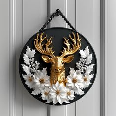 a metal deer head mounted to the side of a door with white and gold flowers