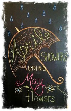 a chalkboard sign with the words april showers, brimming may flowers