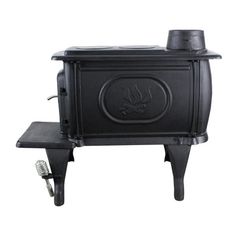 a black stove sitting on top of a wooden table