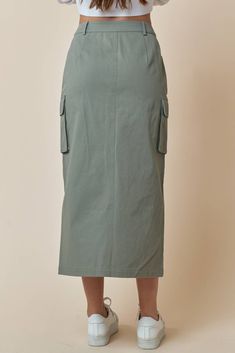 This stylish Cargo Utility Skirt is a great addition to your casual wardrobe. Featuring belt loops, a zip-fly and a button closure, and handy utility pockets, you'll be ready to take on any adventure! All in the comfort of 100% cotton. What are you waiting for? Suit up! Khaki Cargo Skirt With Side Pockets For Work, Casual Cargo Skirt With Belt Loops For Fall, Green Utility Mini Skirt, Relaxed Solid Cargo Skirt With Pockets, Solid Color Relaxed Cargo Skirt With Pockets, Solid Cargo Skirt With Pockets And Relaxed Fit, Relaxed Cargo Skirt With Pockets, Solid Color Cargo Skirt With Pockets, Utility Skirt With Side Pockets For Fall