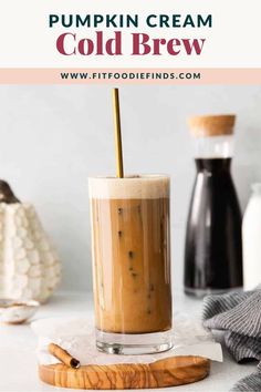 pumpkin cream cold brew in a tall glass with a straw garnish on top