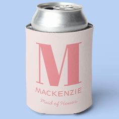 a pink and white can cooler with the letter m on it's front side